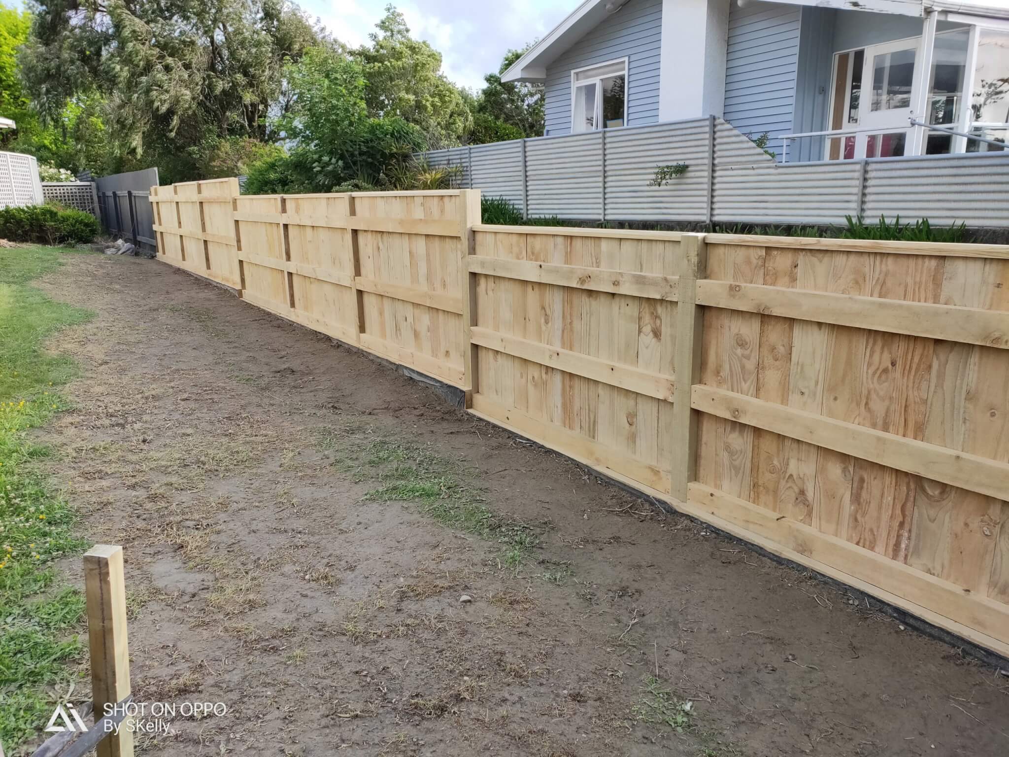 fence ontop of retaining wall scaled